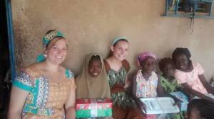 Terra with children recieving shoesboes in Niger.